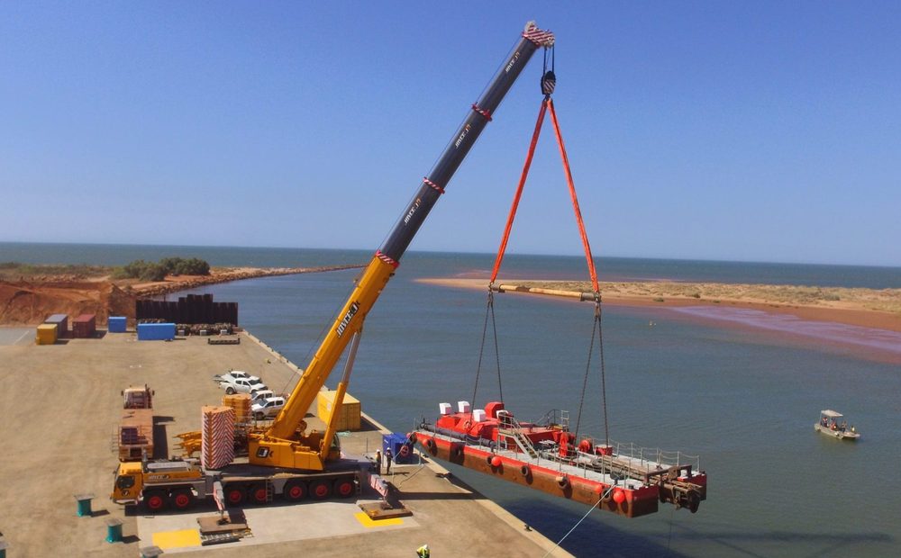 Joyce Krane crane lifting a barge at a port